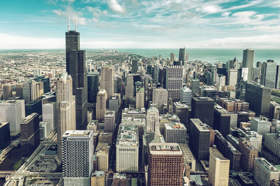 Contact - Aerial View of Downtown Chicago Skyline and Lake in the Distance on a Sunny Day